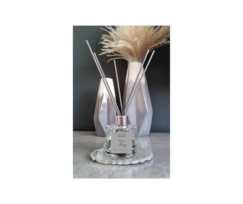 Reed diffuser glass and reeds in the scent very berry by the smelly wax company